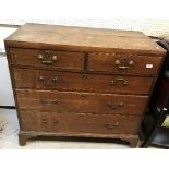 A 19th Century oak chest of two short over three long graduated drawers with brass swan neck