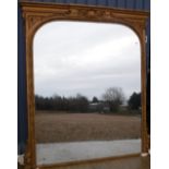 A late Victorian giltwood and gesso framed over mantle mirror,