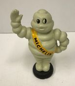 A modern painted cast iron Michelin figure,