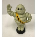 A modern painted cast iron Michelin figure,