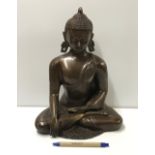 A modern cast bronze statue of Sakyamuni Buddha,