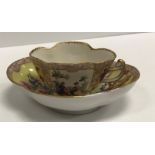A 19th Century Meissen type cabinet cup of lobed form decorated with yellow ground floral decorated