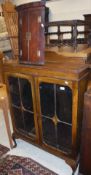 A 19th Century mahogany bow fronted hanging corner cupboard of two doors, of small proportions,