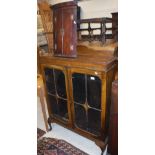 A 19th Century mahogany bow fronted hanging corner cupboard of two doors, of small proportions,