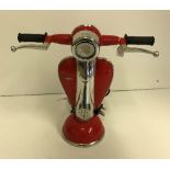 A red scooter table lamp, inscribed "Vespa",