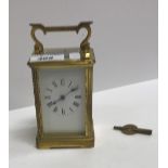 A circa 1900 lacquered brass cased carriage timepiece, approx 14.