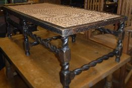 An early 20th Century over-sized stool / coffee table with Bergere top,