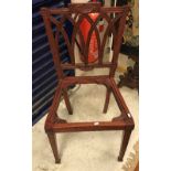 A set of twelve Indian carved hardwood framed dining chairs in the George III manner,