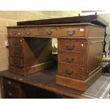 A modern mahogany double pedestal desk, the top with tooled and gilded leather insert,