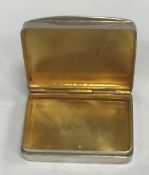 A 20th Century silver "castle top" pill box of rectangular form with gilt-washed interior (by S J