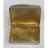 A 20th Century silver "castle top" pill box of rectangular form with gilt-washed interior (by S J