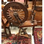 A 19th Century treenware spinning wheel of typical form (provenance: bought from weaver on the Isle