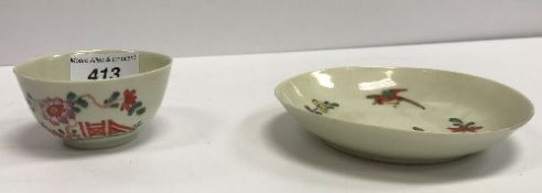 An 18th Century Bow chinoiserie design tea bowl and saucer, tea bowl 7.5 cm diameter, saucer 12.