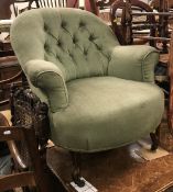 A Victorian buttoned upholstered scroll arm salon chair on moulded cabriole front legs to castors
