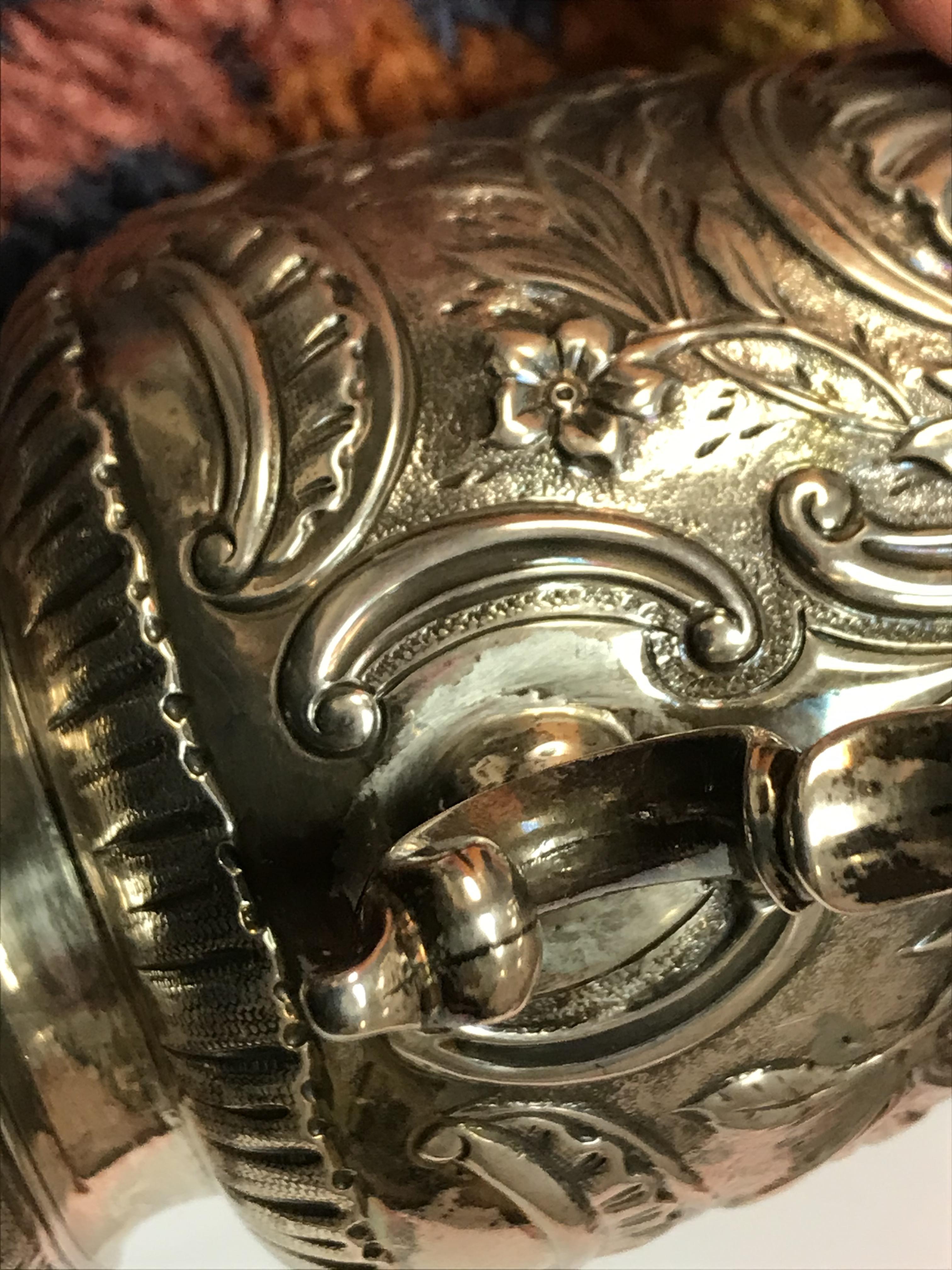 A George II silver baluster shaped mug with later foliate engraved decoration, - Image 12 of 42