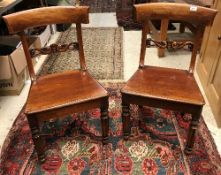 A set of seven Victorian mahogany bar-back panel-seated dining chairs on faceted and turned front