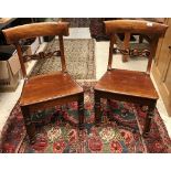 A set of seven Victorian mahogany bar-back panel-seated dining chairs on faceted and turned front