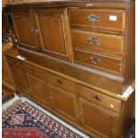 A modern mahogany Stag sideboard, the plain top above four drawers and four cupboards,