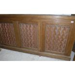 A modern oak fish tank stand as a three door side cabinet,