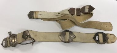 Two Victorian kid leather belts with engraved silver mounts and buckles (by Bent & Parker,