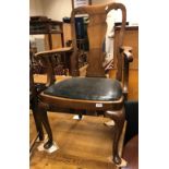 A pair of early 20th Century walnut carver chairs in the early 18th Century manner with vase shaped