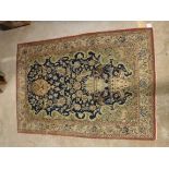 A Qum prayer rug, the central panel set with Mihrab style design vase of flowers,