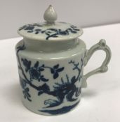 An 18th Century Worcester blue and white mustard pot with open scrollwork handle and plain cover, 8.