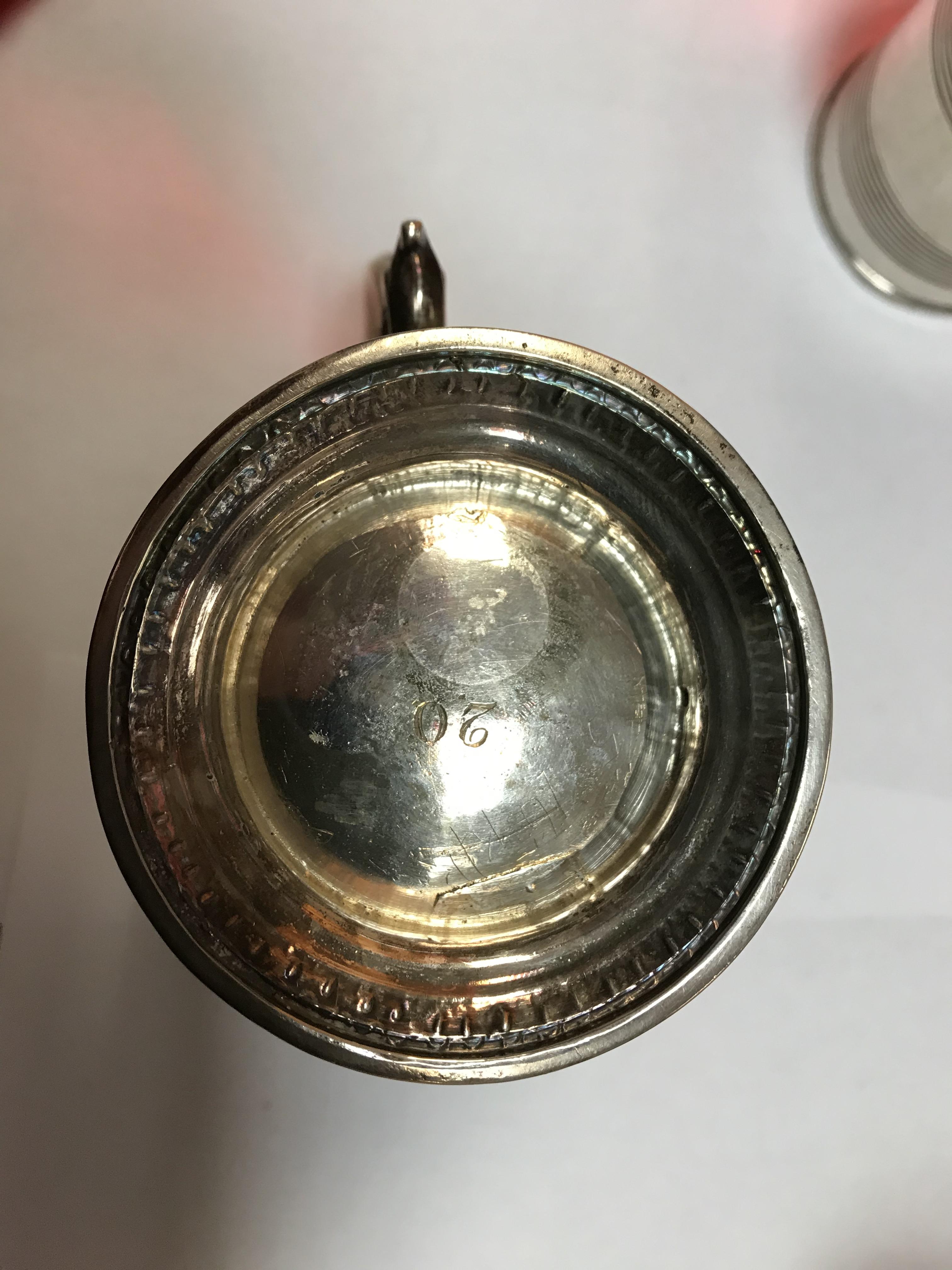 A George II silver baluster shaped mug with later foliate engraved decoration, - Image 16 of 42