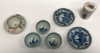 Three Chinese blue and white decorated tea bowls and two matching saucers,
