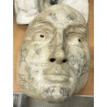 A late 20th Century papier-mache mask of large proportions as a man's face set with vignettes