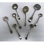 A collection of eight various 19th Century silver sifter spoons, various designs, dates and makers,