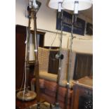 A pair of brass and iron based standard lamps in the 19th Century manner,