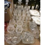 A collection of glassware to include two pineapple cut glass decanters, one with handle,