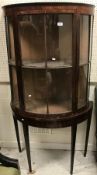 A 19th Century rosewood veneered display cabinet of demilune form,
