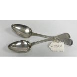 A pair of early 19th Century Jersey silver "Old English" pattern tablespoons with bright cut