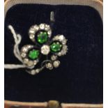 A Victorian diamond and peridot set "clover" brooch, the centre stone approx 0.15 carat, 2 cm x 1.