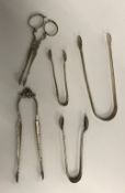 Three pairs of sugar tongs various sizes, dates and makers,