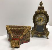 A 19th Century French red tortoiseshell and brass inlaid boulle work decorated mantle clock in the