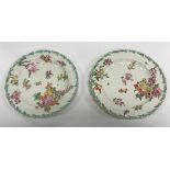 A pair of 18th Century Chelsea dishes with scrolling acanthus rims and central floral spray