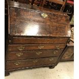 An 18th Century North Country oak bureau,