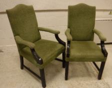 A pair of modern upholstered Gainsborough style armchairs with swept arms on moulded supports