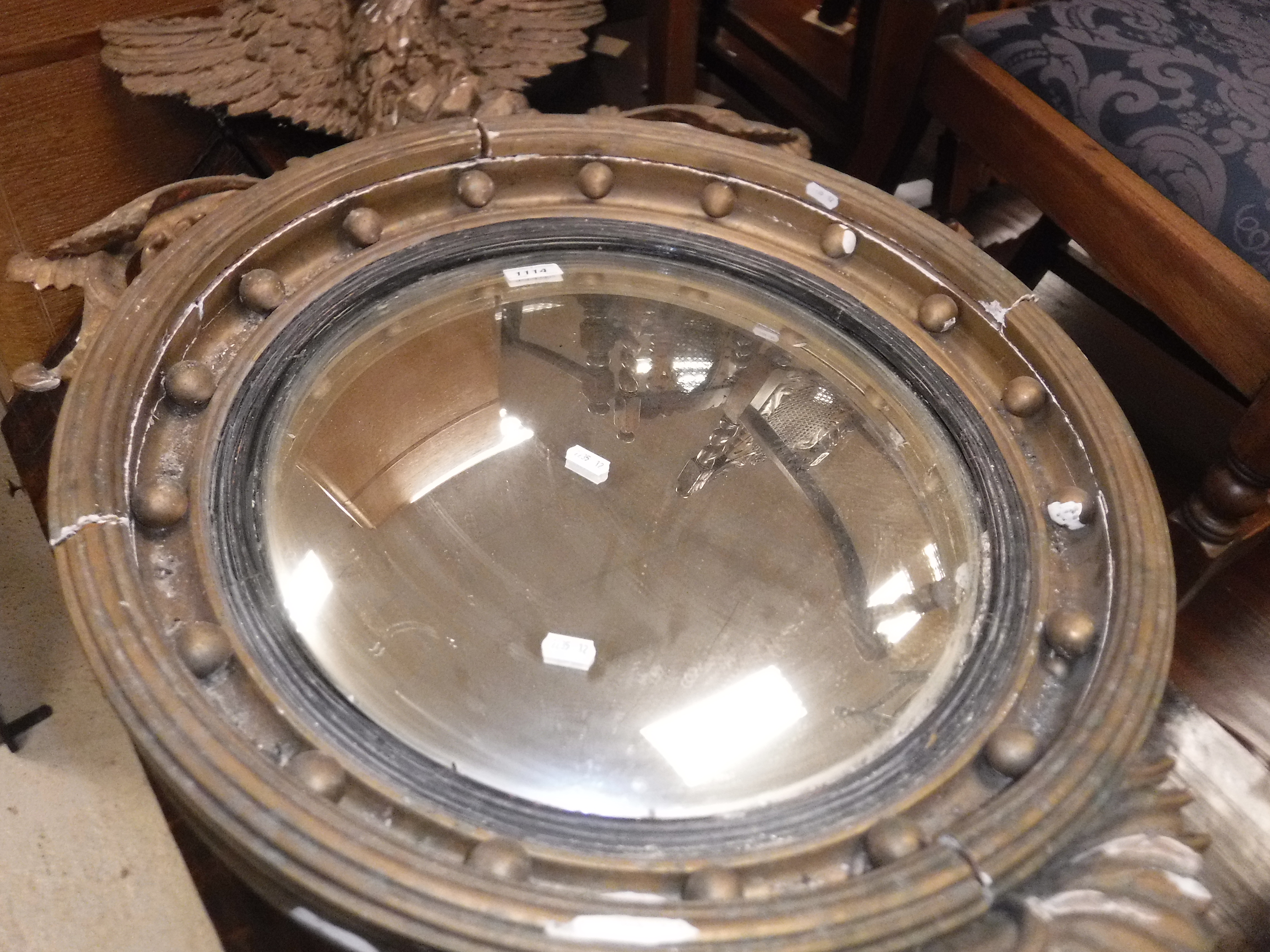 A 19th Century convex wall mirror with spreadeagle surmount and ball decoration to the frame, - Image 12 of 16