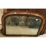 A late Victorian giltwood and gesso framed shallow dome top over mantle mirror within a rope work