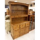 A modern pine dresser, 121 cm wide x 43 cm deep x 186 cm high,