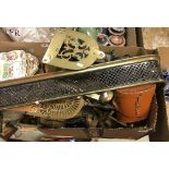 A box of assorted metal wares to include two trivets, a fire guard, chestnut roaster, etc,