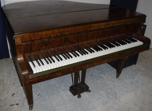 A burr walnut cased boudoir grand piano with iron framed over strung movement by Boyd of London 142