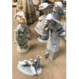 A Lladro figure of a woman with basket of bread and puppy at her feet,