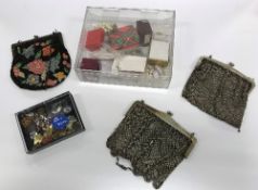 A box of various costume jewellery, commemorative thimbles, badges,