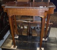 An early 20th Century mahogany fold-over card table,