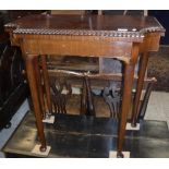 An early 20th Century mahogany fold-over card table,